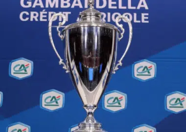 Shiny silver trophy on a blue backdrop adorned with Cr&eacute;dit Agricole logos