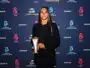 Young woman in a black blazer holding an award on a blue sponsor backdrop (logos include Canal+, Arkema, and Troph&eacute;es).