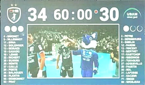 1000025711 | AllezPaillade.com Scoreboard showing 34-30 with 60:00 on the timer; photo of handball players shaking hands on a blue court, team logos on the sides.