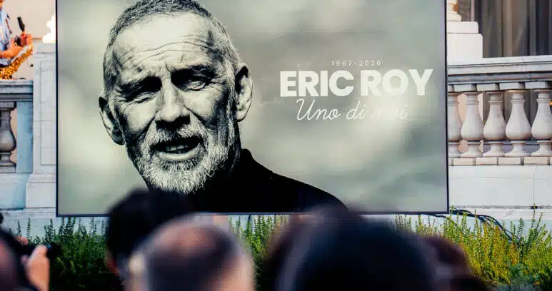 Dante - Tribute - OGN Nice - 18062026 | AllezPaillade.com Large outdoor billboard featuring a black-and-white portrait of Eric Roy, with the text '1967-2026 ERIC ROY Uno di moi' on a gray background.