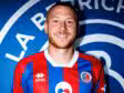 Welcome banner featuring Romain Caumet and a man in a red-and-blue striped soccer jersey against a blue backdrop, smiling.