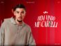 Portrait of Lucas Mincarelli Davin against a red background with a bold 'Bem-Vindo Mincarelli' welcome graphic on the right.