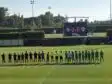 Screenshot | AllezPaillade.com Lineups of two soccer teams shaking hands before a match on a sunny field, scoreboard showing 0-0 in the background