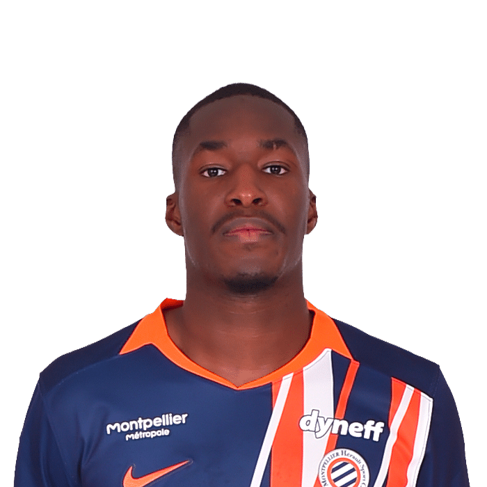 Portrait of a Black male soccer player wearing a navy jersey with orange stripes and sponsor logos, facing camera.