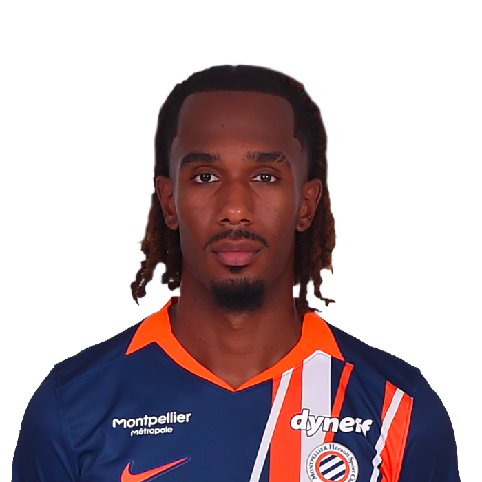 29-tchato | AllezPaillade.com Portrait of a male soccer player in a navy blue jersey with orange accents, facing the camera.