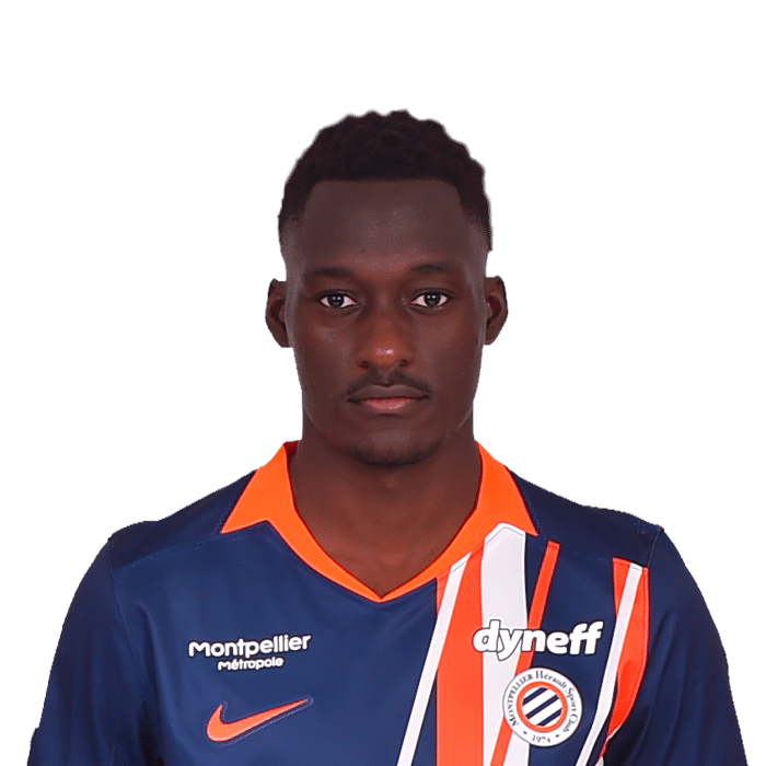Portrait of a young Black male soccer player in a blue jersey with orange accents and bold stripes.