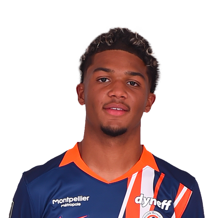 9-lacine | AllezPaillade.com Portrait of a young male soccer player in a dark blue jersey with orange trim and vertical orange stripes, facing the camera.