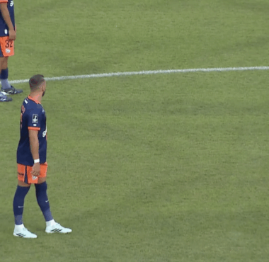 Soccer players in blue and orange uniforms stand near the center line; ball sits on the field as a 0-0 scoreboard and timer appear on screen (00:22) with a beIN SPORTS logo.
