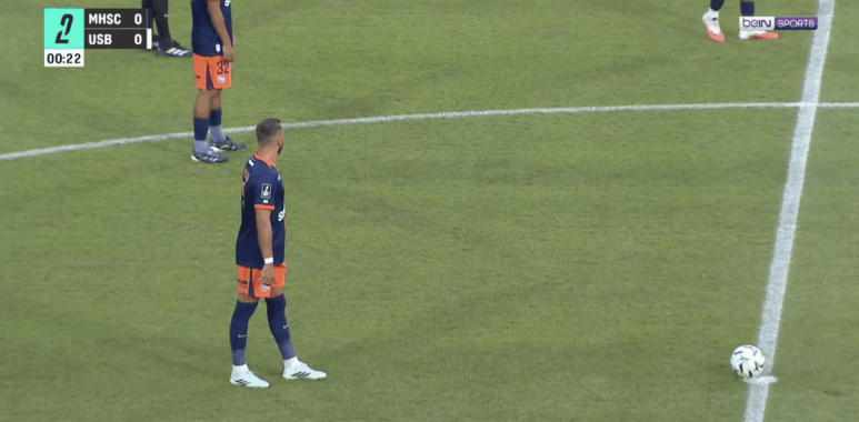 Capture décran 2026-08-28 à 222425 | AllezPaillade.com Soccer players in blue and orange uniforms stand near the center line; ball sits on the field as a 0-0 scoreboard and timer appear on screen (00:22) with a beIN SPORTS logo.