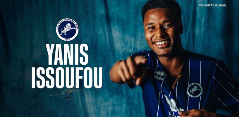 Promotional banner: smiling player in blue pinstripe jersey pointing at the camera with Millwall crest and the text 'YANIS ISSOUFOU' on a teal backdrop; 'WELCOME TO MILLWALL' unreadable at top-right.