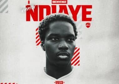 Grayscale head-and-shoulders portrait on a promotional poster with bold red text and diagonal red stripes in the background.