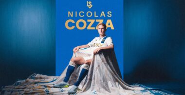 Poster featuring Nicolas Cozza in a white soccer kit on a blue background, with his name in gold lettering above him